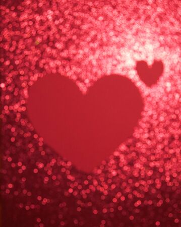 Blurred background with sequins and a big heart for Valentine's Day, Valentine's Day. The concept of loveの写真素材