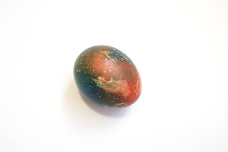 Abstractly colored one egg. Easter. white background. A place for text. Space Martian Eggの写真素材