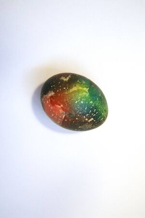 Abstractly colored one egg. Easter. white background. A place for text. Space Martian Eggの写真素材