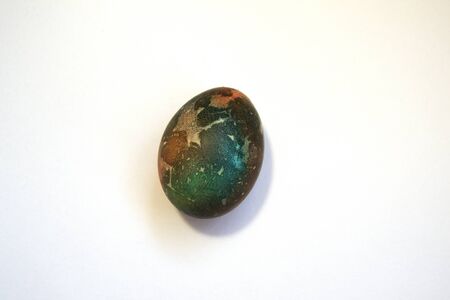 Abstractly colored one egg. Easter. white background. A place for text. Space Martian Eggの写真素材