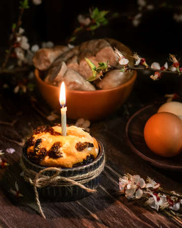 Easter table with Easter cake, homemade sausage and homemade eggs.Happy easter holiday. Dark...