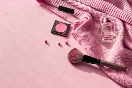 Womens cosmetics and fashion items on pink background with copy space, top view.Beauty and fashion blog concept.の写真素材