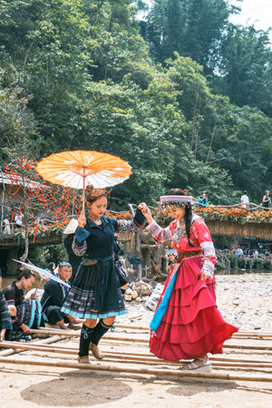 Sa Pa, Vietnam- 05.12.2024. Women enjoying traditional bamboo danceの写真素材