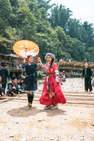 Sa Pa, Vietnam- 05.12.2024. Women enjoying traditional bamboo danceの写真素材