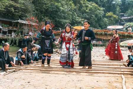 Sa Pa, Vietnam- 05.12.2024. Women enjoying traditional bamboo danceの写真素材