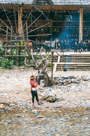 Sa Pa, Vietnam- 05.12.2024. Rustic Village Scene with Wooden Wheelの写真素材