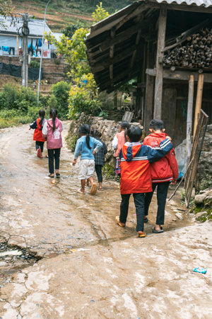 Sa Pa, Vietnam- 05.12.2024. Group of children walking through villageの写真素材