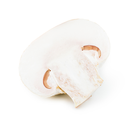 one fresh champignon mushroom cut in half isolated on white backgroundの写真素材