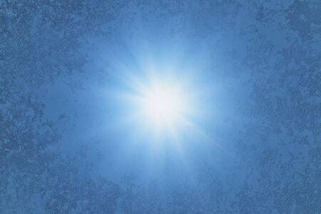Blue textured background. Glow in the center. Rays of light.の写真素材