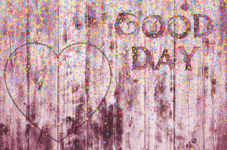 The inscription Good day on a texture of wood. Have a good day. Heart, candy, holiday date.