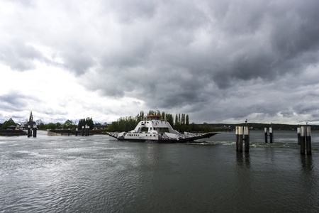 the ferry boat for vehicles transportatian across the riverの写真素材