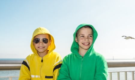 Two smiling teenage boys on deck of ferry - romantics