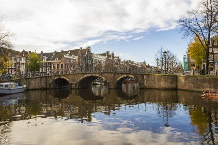 View on a canal bridge in Amsterdam in late autumnの写真素材