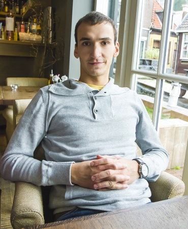 Portrait of smiling handsome man indoorsの写真素材