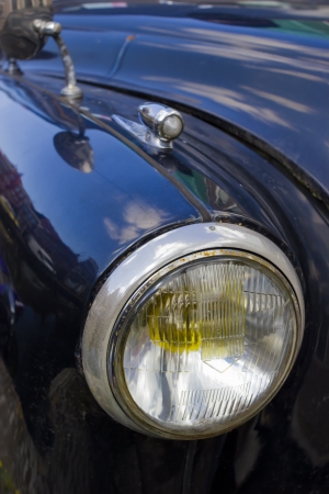 Fragment of retro car - headlight close upの写真素材