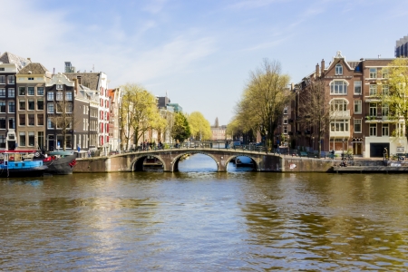 View on the houseboats with cruiseboat in Amsterdam the Netherlandsの写真素材