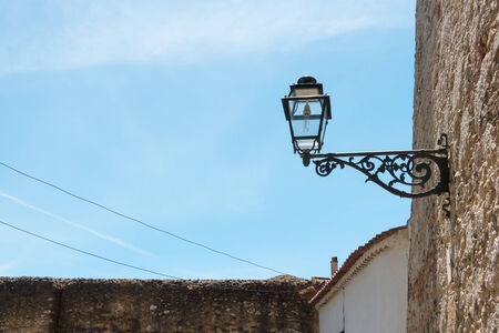 beautiful and traditional view of antique building and lamp in Lisbon, Portugal