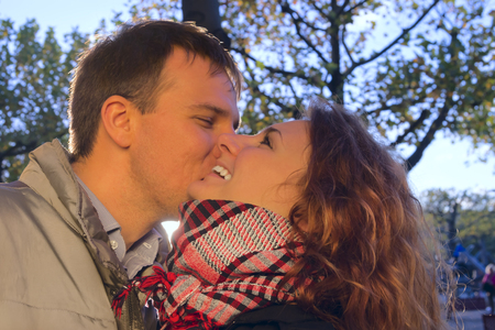 Outdoor happy couple in love, autumn Amsterdam backgroundの写真素材