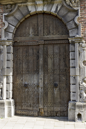 Old wooden door in Ghent, Belgiumの写真素材