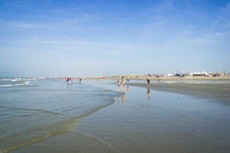 People spending sunny day on the sand beach in Hoek van Holland, the Netherlands on July 12th, 2015のeditorial素材