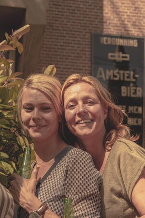 Amsterdam, Netherlands - August 3, 2013: A vintage color tone picture  of Amsterdam gay parade in a canal on a sunny day with people greeting prideのeditorial素材