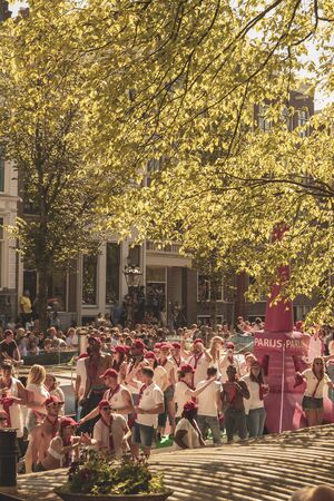 Amsterdam, Netherlands - August 3, 2013: A vintage color tone picture  of Amsterdam gay parade in a canal on a sunny day with people having fun dancing on a boatのeditorial素材