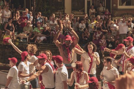 Amsterdam, Netherlands - August 3, 2013: A vintage color tone picture  of Amsterdam gay parade in a canal on a sunny day with people having fun dancing on a boatのeditorial素材