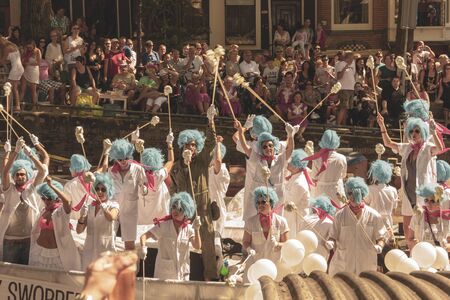 Amsterdam, Netherlands - August 3, 2013: A vintage color tone picture  of Amsterdam gay parade in a canal on a sunny day with people having fun dancing on a boatのeditorial素材