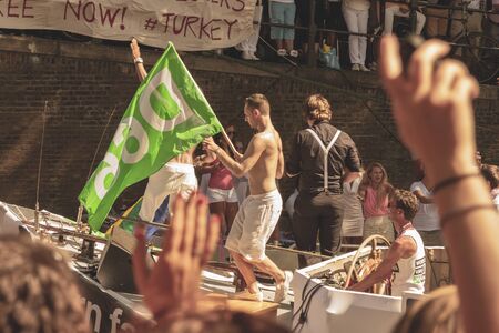Amsterdam, Netherlands - August 3, 2013: A vintage color tone picture  of Amsterdam gay parade in a...