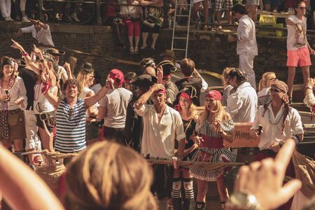 Amsterdam, Netherlands - August 3, 2013: A vintage color tone picture  of Amsterdam gay parade in a canal on a sunny day with people having fun dancing on a boatのeditorial素材