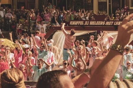 Amsterdam, Netherlands - August 3, 2013: A vintage color tone picture  of Amsterdam gay parade in a canal on a sunny day with people having fun dancing on a boatのeditorial素材