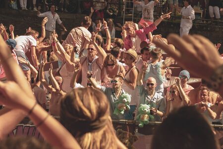Amsterdam, Netherlands - August 3, 2013: A vintage color tone picture  of Amsterdam gay parade in a canal on a sunny day with people having fun dancing on a boatのeditorial素材