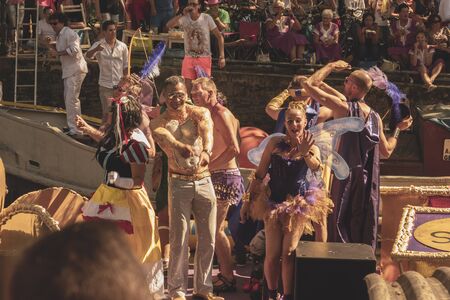 Amsterdam, Netherlands - August 3, 2013: A vintage color tone picture  of Amsterdam gay parade in a canal on a sunny day with people having fun dancing on a boatのeditorial素材