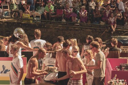 Amsterdam, Netherlands - August 3, 2013: A vintage color tone picture  of Amsterdam gay parade in a canal on a sunny day with people having fun dancing on a boatのeditorial素材