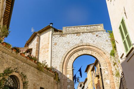 Arched medieval street in the town of Assisi, Italyの写真素材