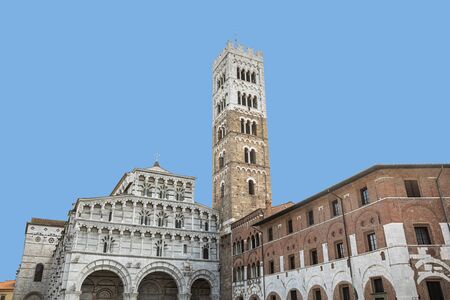 The beautiful frontage of Cathedral of San Martin with its tall bell tower, Lucca, Italyの写真素材