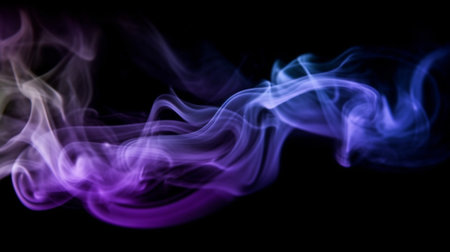 Purple and blue coloured smoke on black background. Abstract background.の写真素材