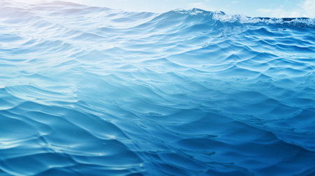 Blue sea wave background. Water surface with sun reflection. Water surface textureの写真素材