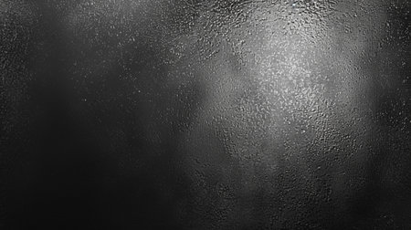 Water drops on a black wall. Abstract background and texture for design.の素材