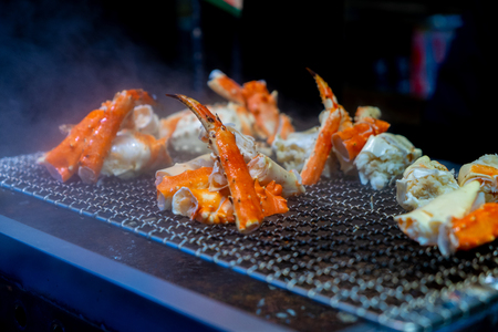 Alaska crab grill in fish market japanの写真素材