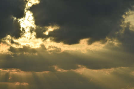 Sunlight shining through the gaps in the clouds
