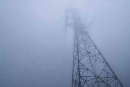 Steel tower in the fogの写真素材