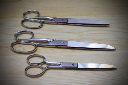 scissors on wood backgroundの写真素材