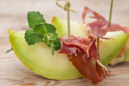 Concept of spanish food with melon and prosciuttoの写真素材
