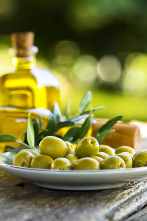 dish of olives on wooden backgroundの写真素材