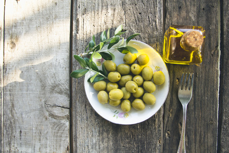 dish of olives on wooden backgroundの写真素材