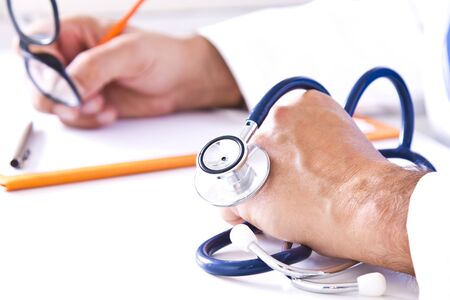 stethoscope on the table medical consultationの写真素材