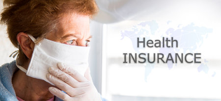 portrait of senior woman with face mask and disposable medical gloves. health insurance conceptの写真素材