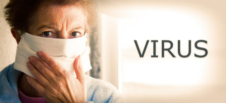 portrait of senior woman with disposable medical mask. Safety in public places during coronavirus outbreak.の写真素材