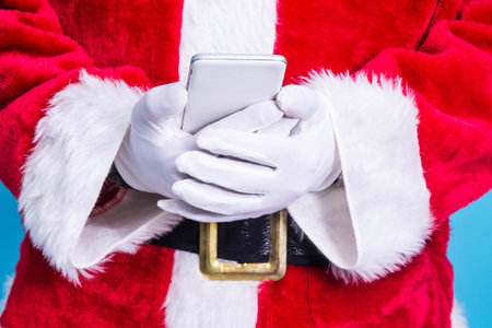 santa claus using mobile phoneの写真素材